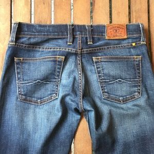 Lucky Brand blue jeans with 7# rise.